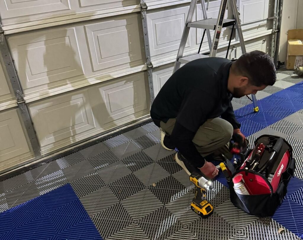 Garage door repair inspection with professional tools in McKinney TX