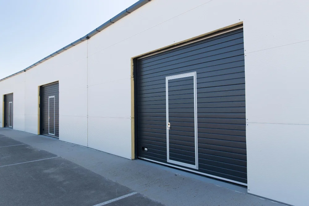 Professional technician providing Garage Door Repair in McKinney for broken spring replacement and smooth door operation