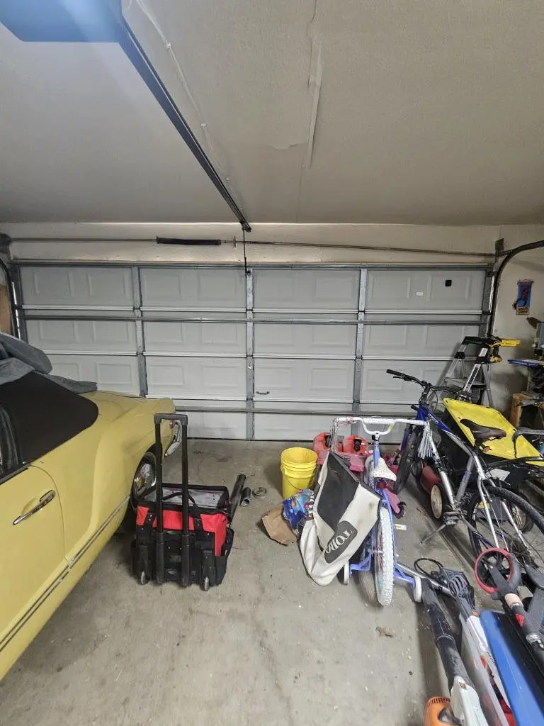 Garage Door Repair service fixing broken torsion spring for smooth door operation