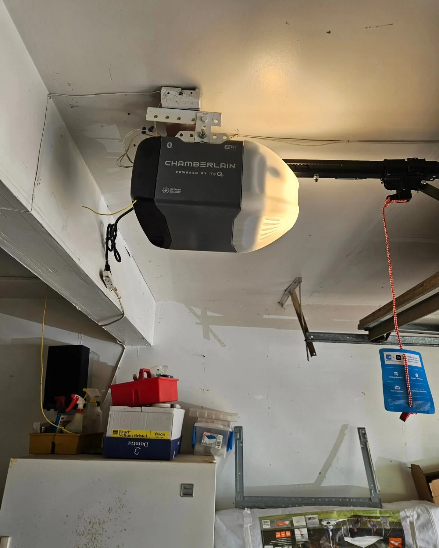 Technician performing Garage Door Repair in Fairview while inspecting and testing a garage door opener system