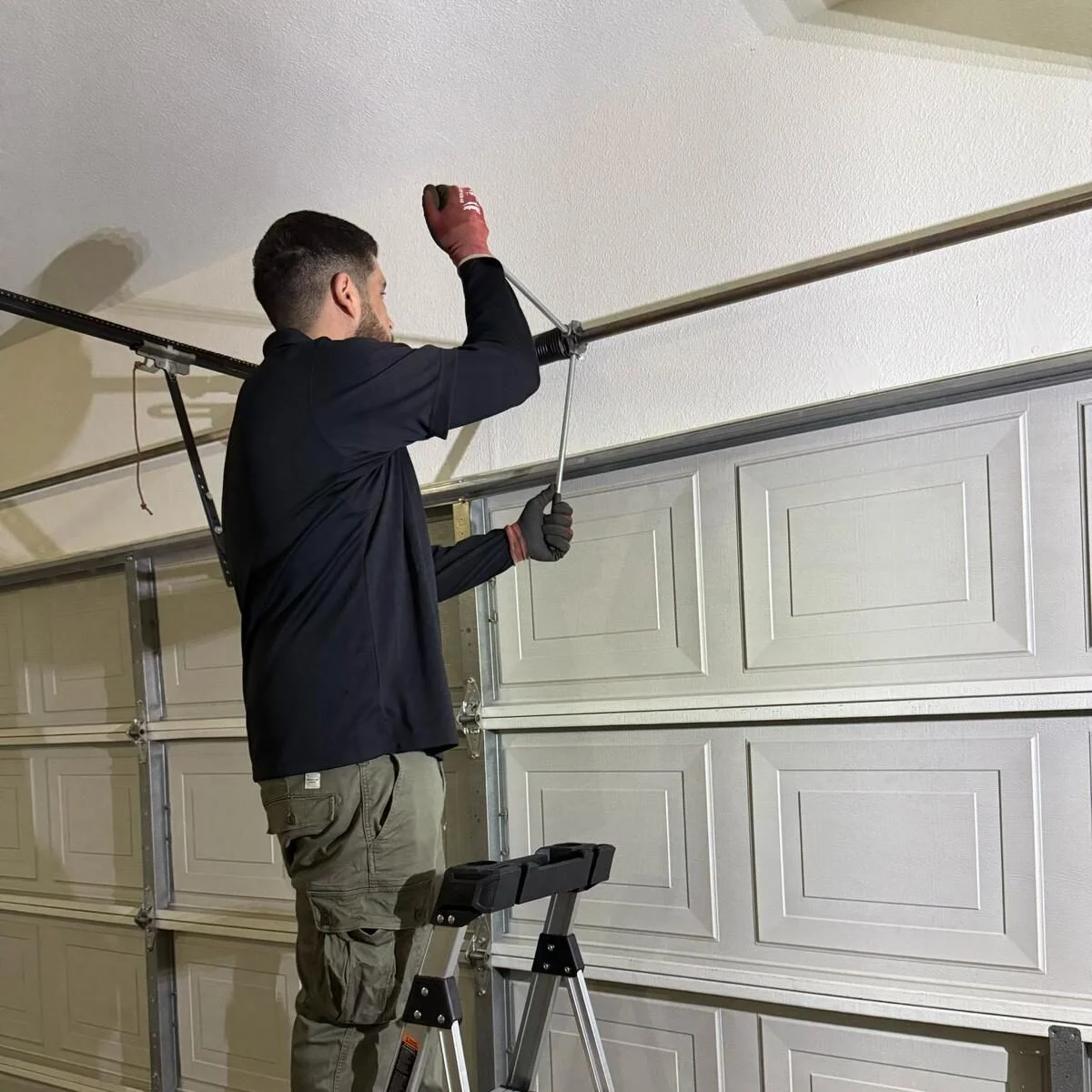 Professional technician performing Garage Door Fix on residential garage door system