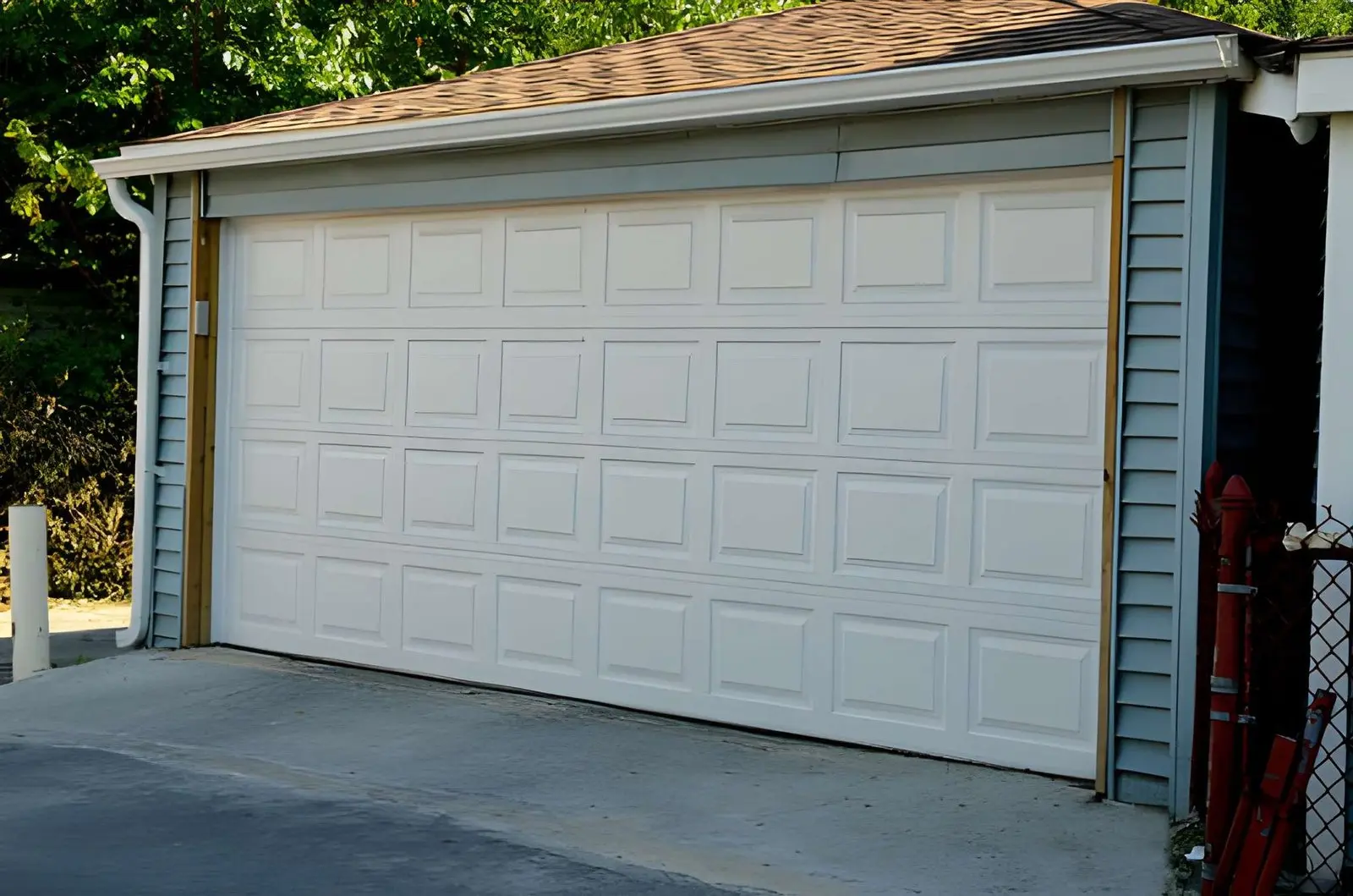 Professional technician performing Liftmaster Garage Door Repair on a residential garage door opener system