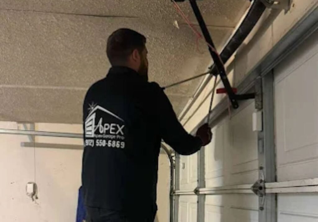 Apex Garage Pro technician adjusting garage door spring hardware