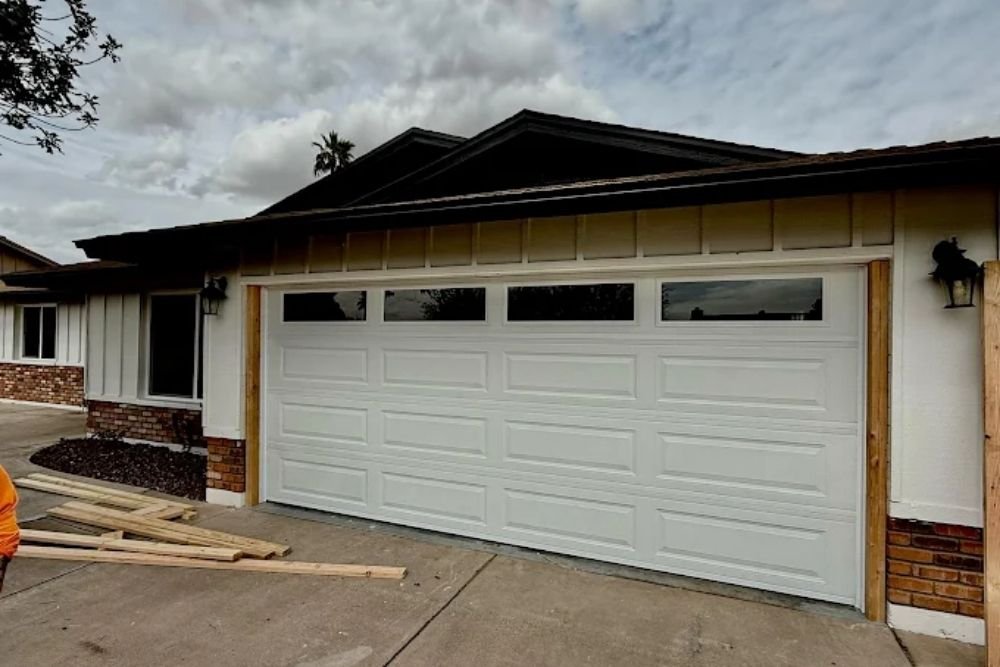 New white garage door with windows installed on a North Texas home